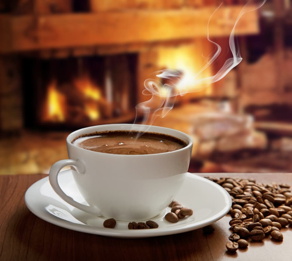 Coffee beside a desk during a build session